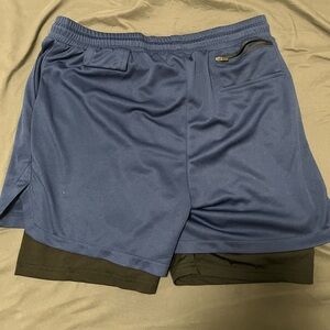Running shorts large 30 to 34 with compression built in and cellphone holder